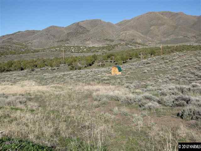 14465 Hope Lane, Unit 75 Reno, NV 89508 - Photo 4 of 7 a view of a dry yard with mountains in the background