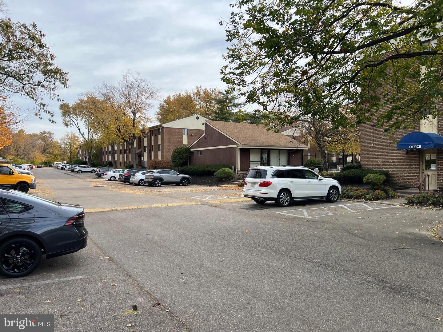9921 Bustleton Avenue, Unit T10 Philadelphia, PA 19115 - Photo 4 of 4 a view of street with parked cars