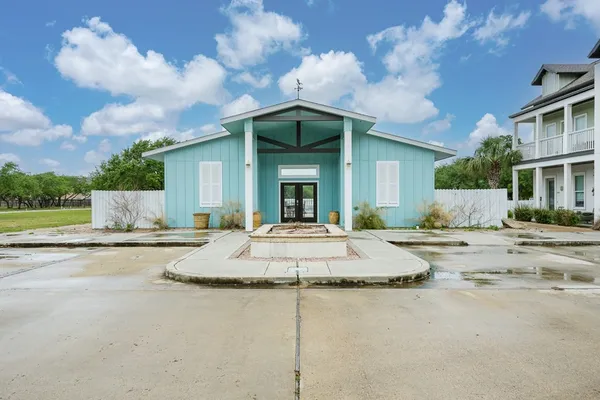 a view of a house with a flat screen tv and outdoor space