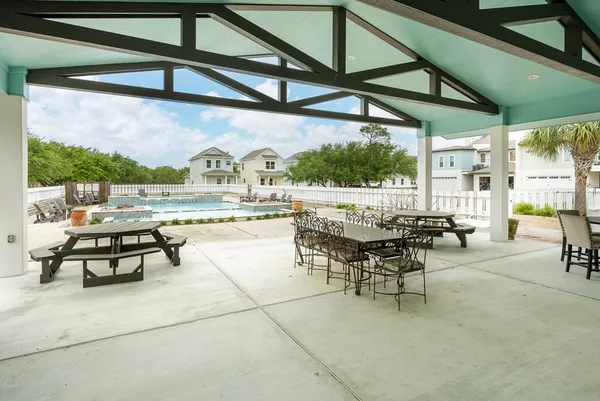 an outdoor space with furniture and outdoor view