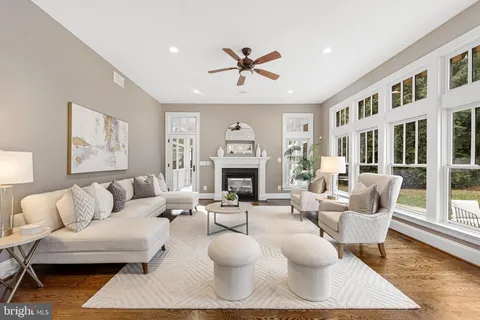 a spacious bedroom with a large bed and a chandelier