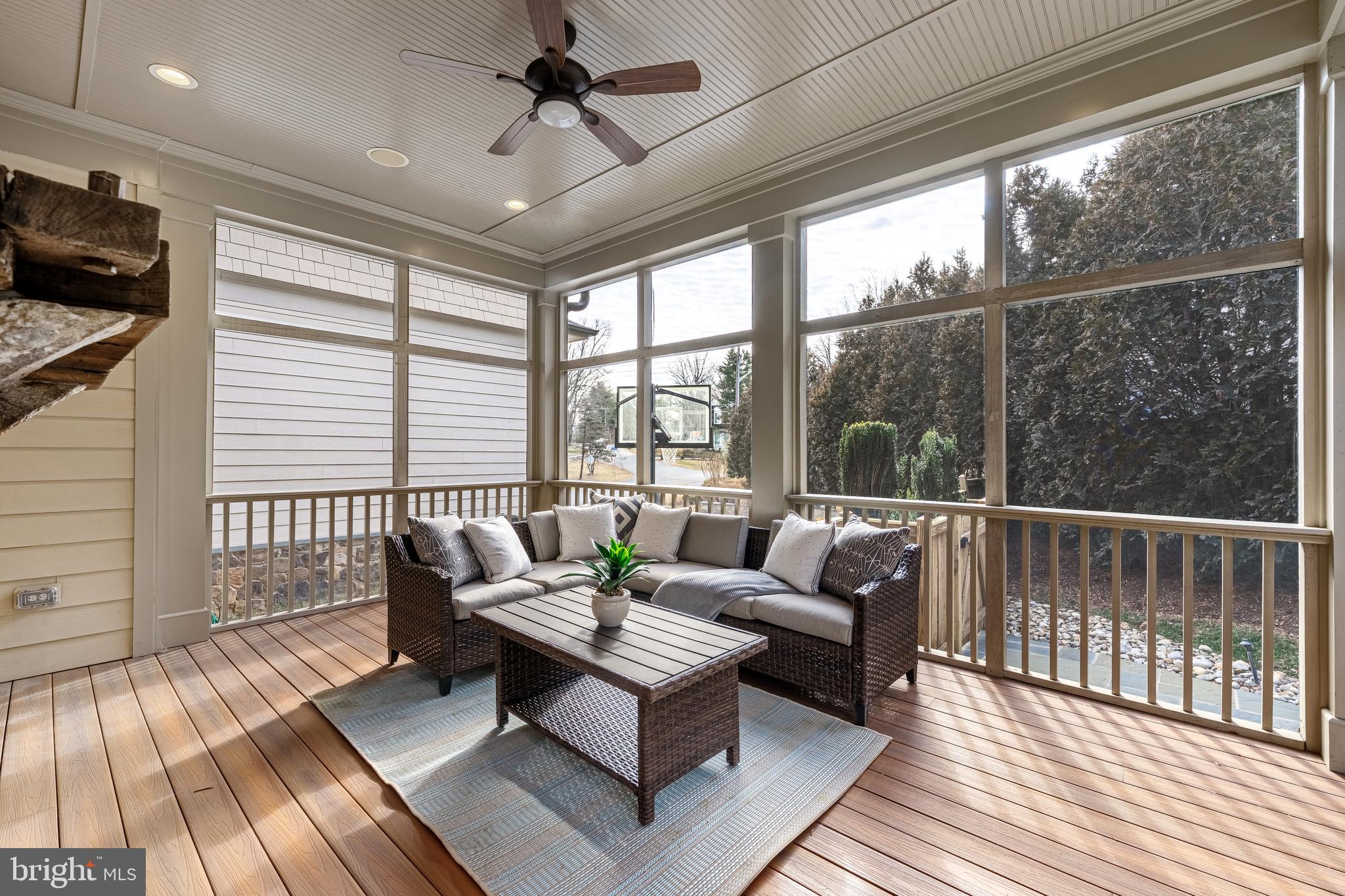 6520 Topeka Road McLean, VA 22101 - Photo 25 of 67 a living room with furniture and a floor to ceiling window