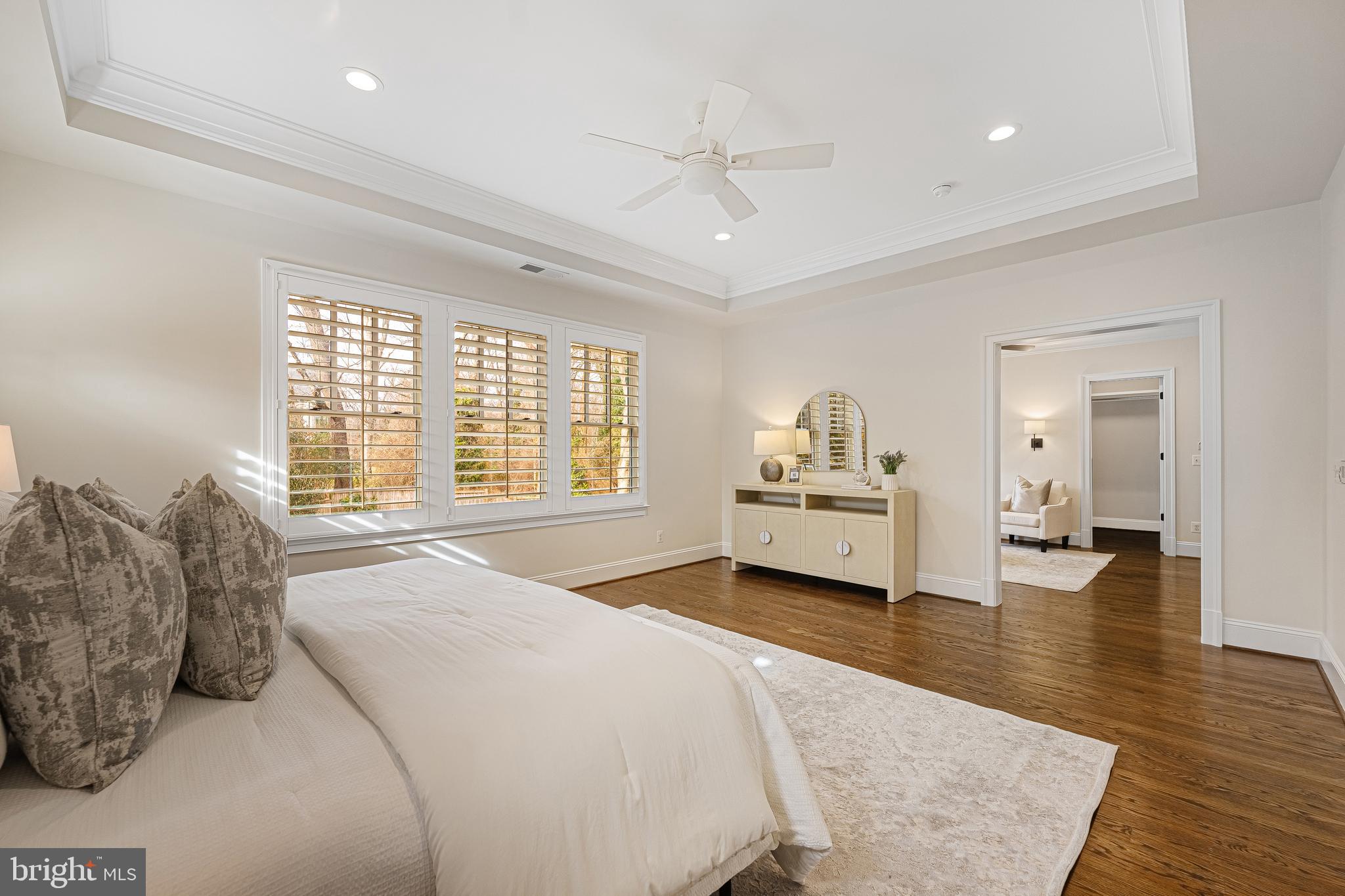 6520 Topeka Road McLean, VA 22101 - Photo 32 of 67 a spacious bedroom with a large bed and a chandelier