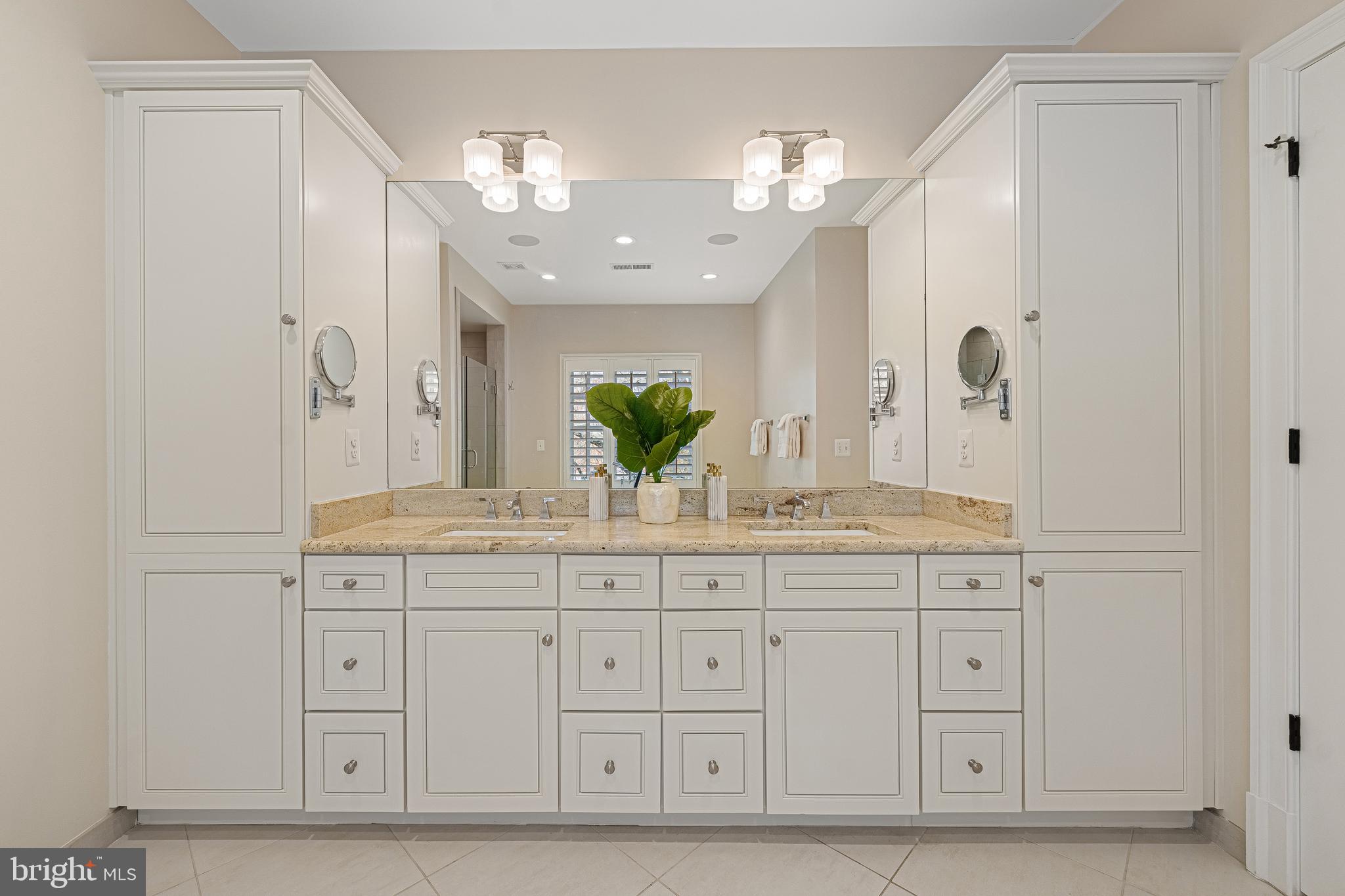 6520 Topeka Road McLean, VA 22101 - Photo 36 of 67 a bathroom with a granite countertop double vanity sink and mirror