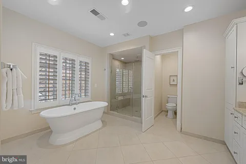 a utility room with sink dryer and washer