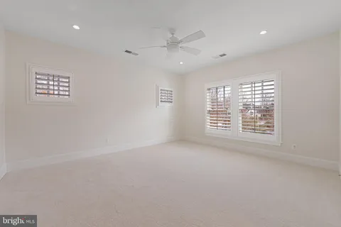 a living room with furniture a rug and wooden floor
