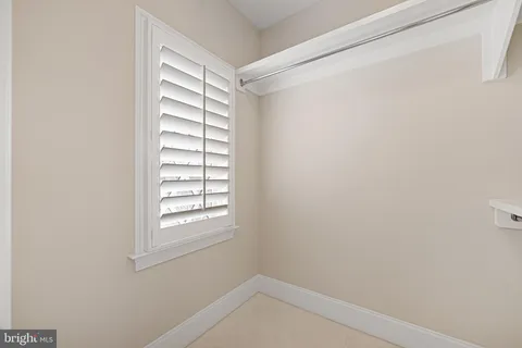 a view of a room with wooden floor and small space