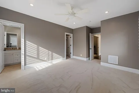 a view of a chair and tables in the balcony