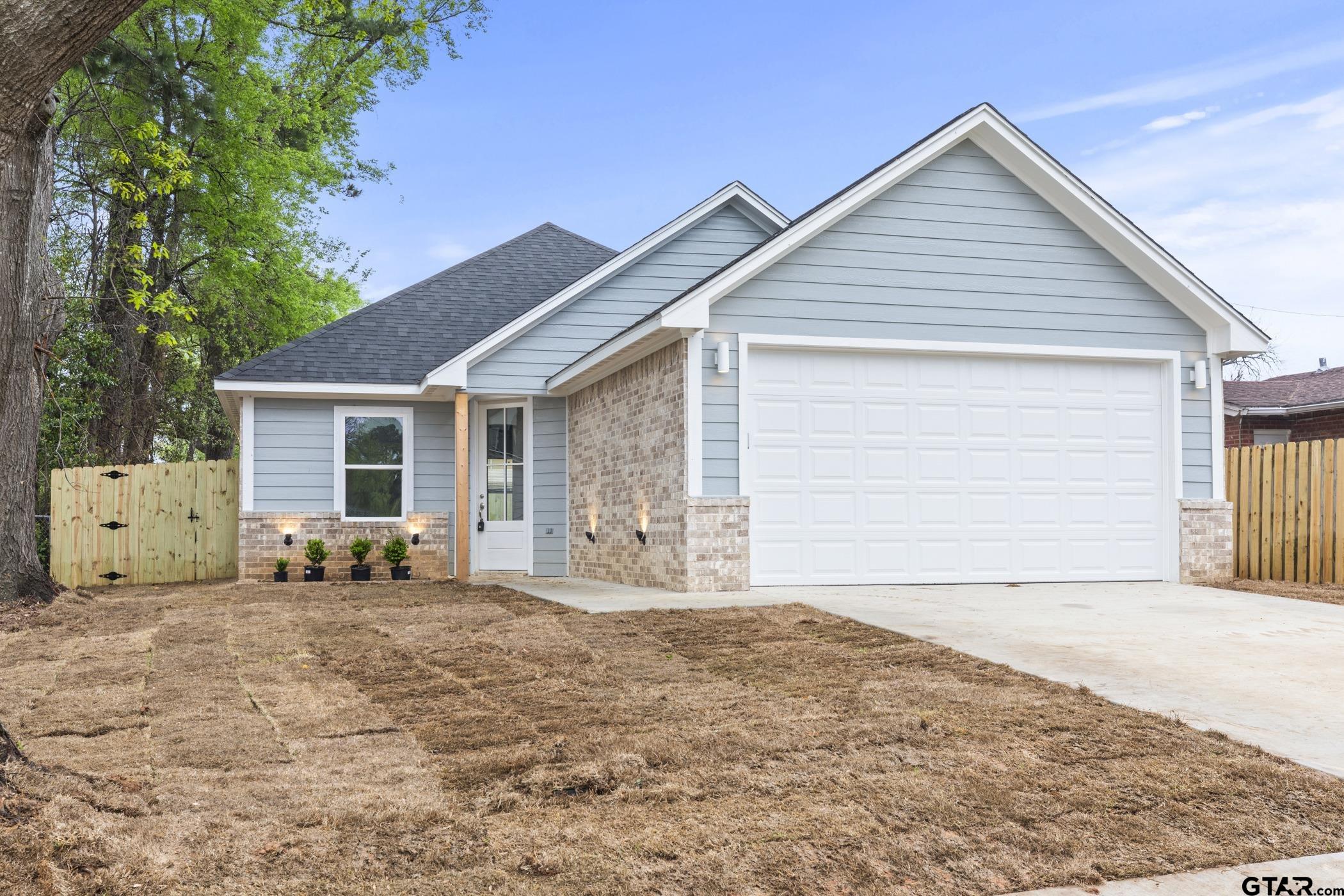 712 West 3rd Tyler, TX 75701 - Photo 2 of 28 a front view of a house with large outdoor space and sitting area