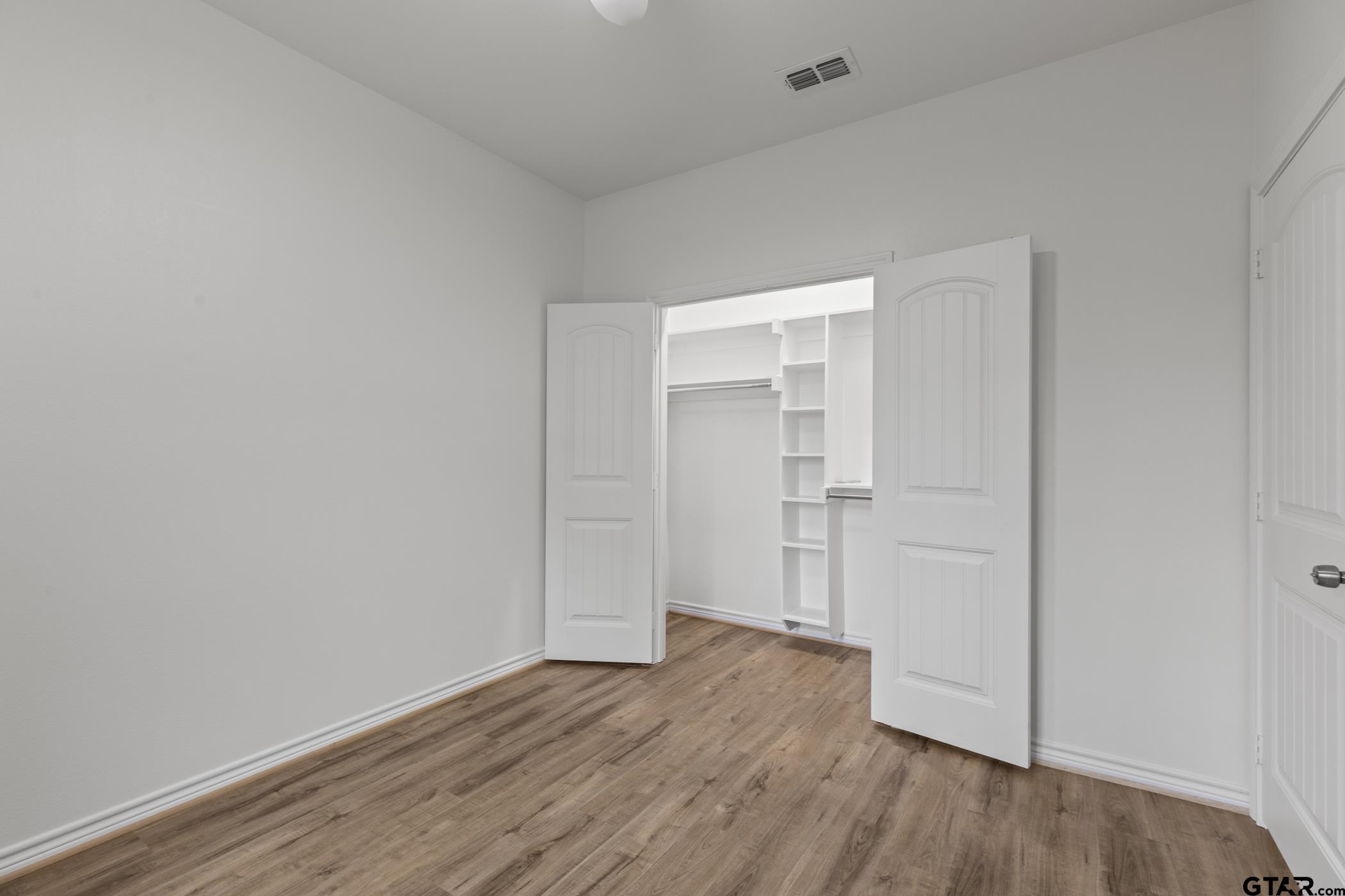 712 West 3rd Tyler, TX 75701 - Photo 22 of 28 a view of an empty room with wooden floor