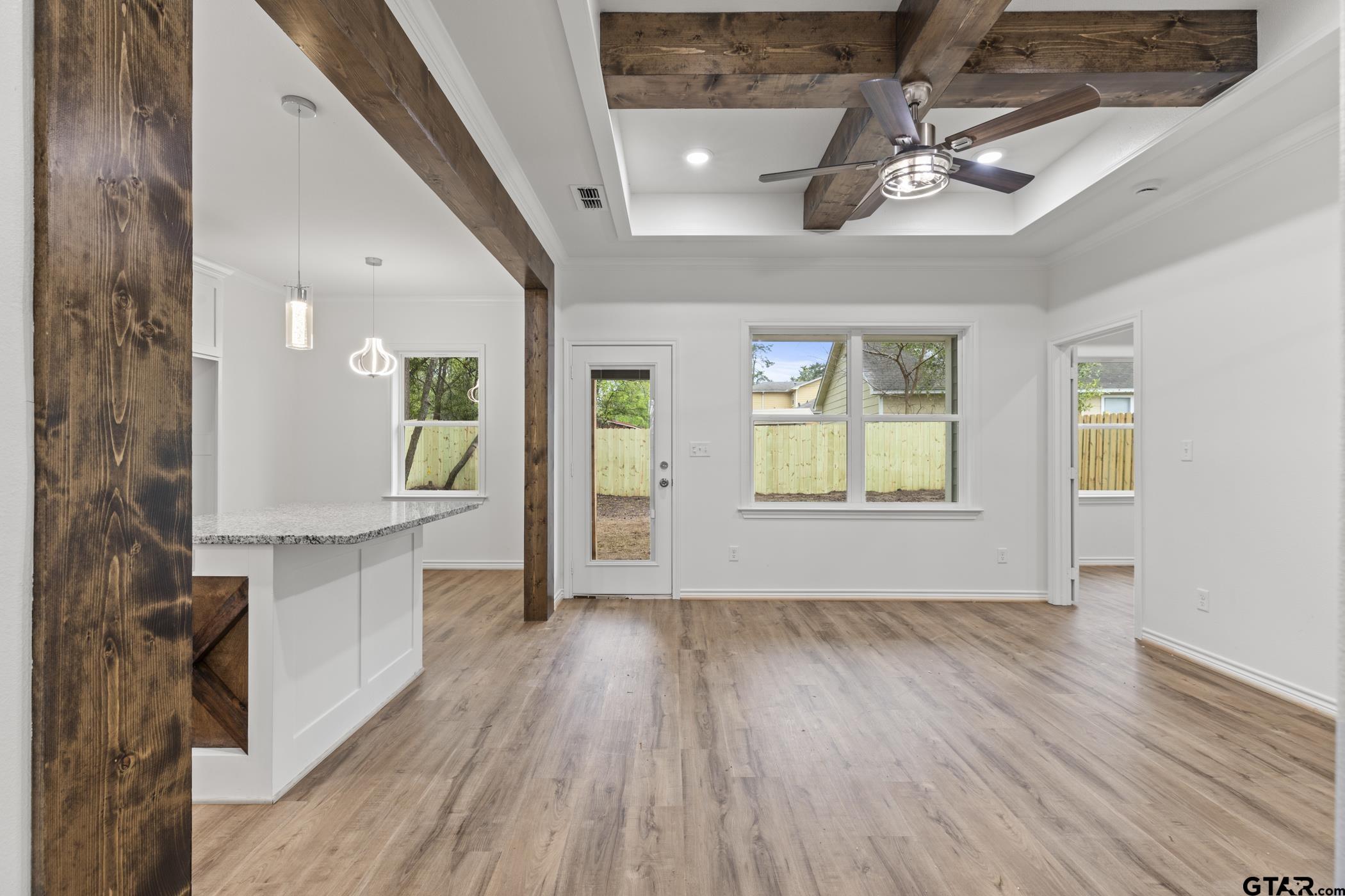 712 West 3rd Tyler, TX 75701 - Photo 10 of 28 a view of a room with wooden floor and windows