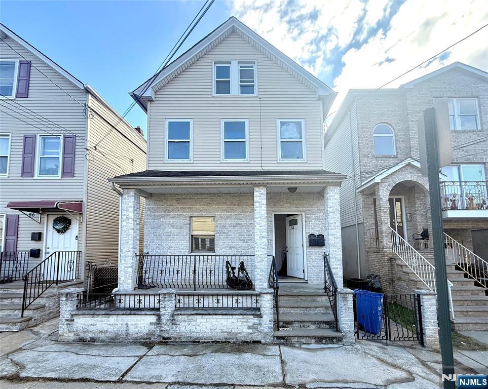 a front view of a house with stairs