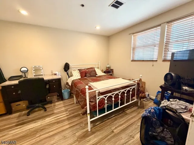 a bed room with a bed and a chair