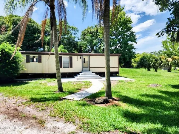 a front view of a house with yard