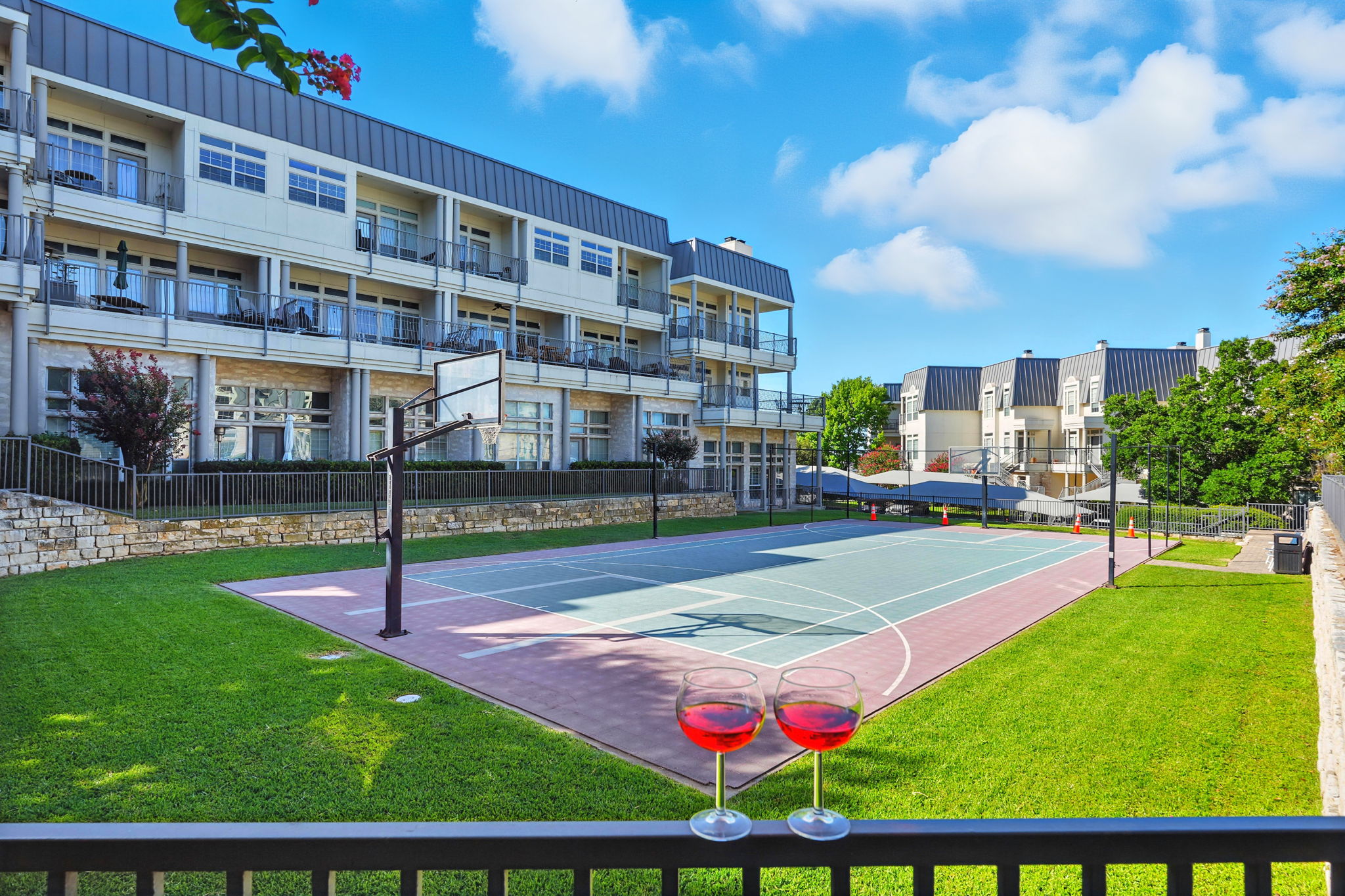 2918 Ranch Road 620 North, Unit C115 Austin, TX 78734 - Photo 37 of 39 View of sport court with plenty of natural light, community basketball court, and a residential view