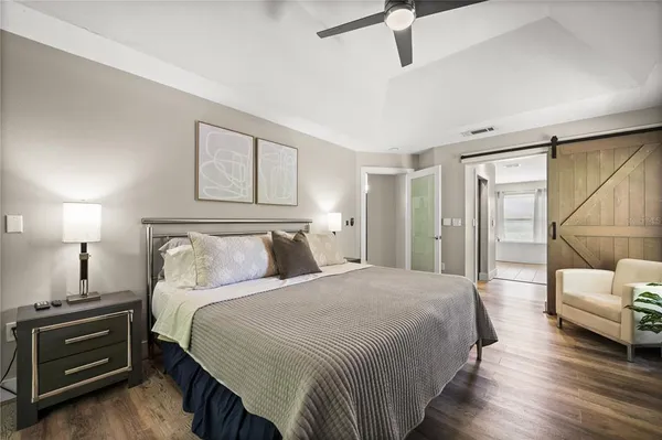 a bedroom with a bed and a couch