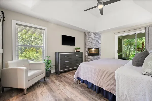 a bedroom with a bed and a couch