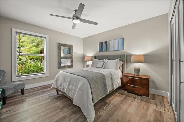 a bedroom with a large bed and a window