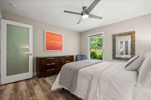 a bedroom with a bed and a dresser