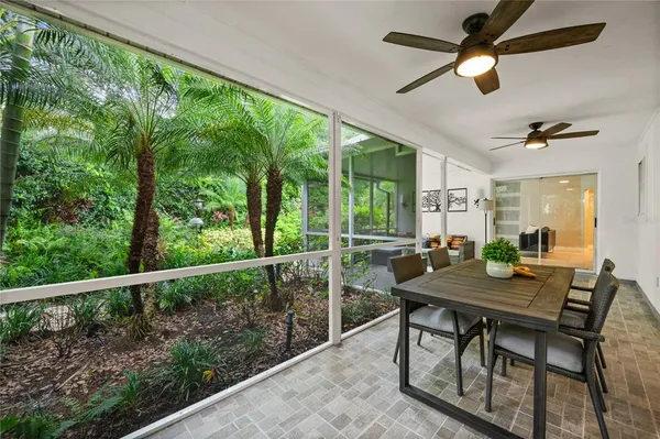 a view of a dining room with furniture window and outside view