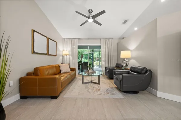 a living room with furniture and a large window