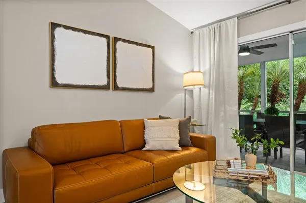 a living room with furniture and a large window