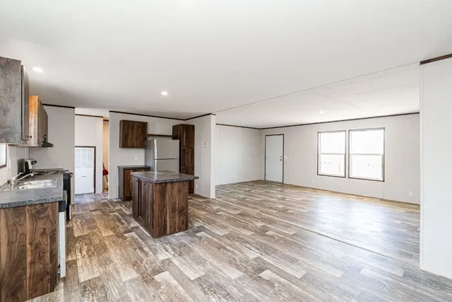 a view of kitchen with furniture and wooden floor
