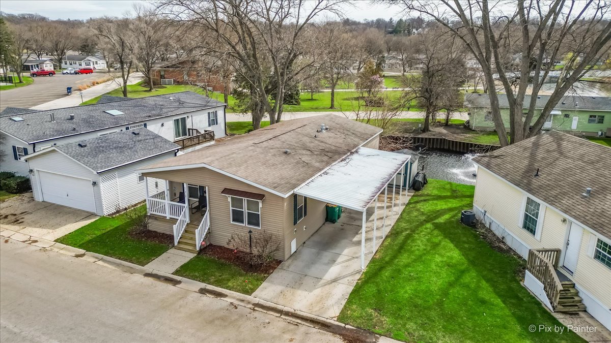 173 Northshore Road Elgin, IL 60123 - Photo 39 of 39 a aerial view of a house with a yard and potted plants