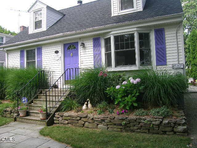 155 Turney Road Fairfield, CT 06824 - Photo 1 of 1 a view of a house with brick walls and a yard with plants
