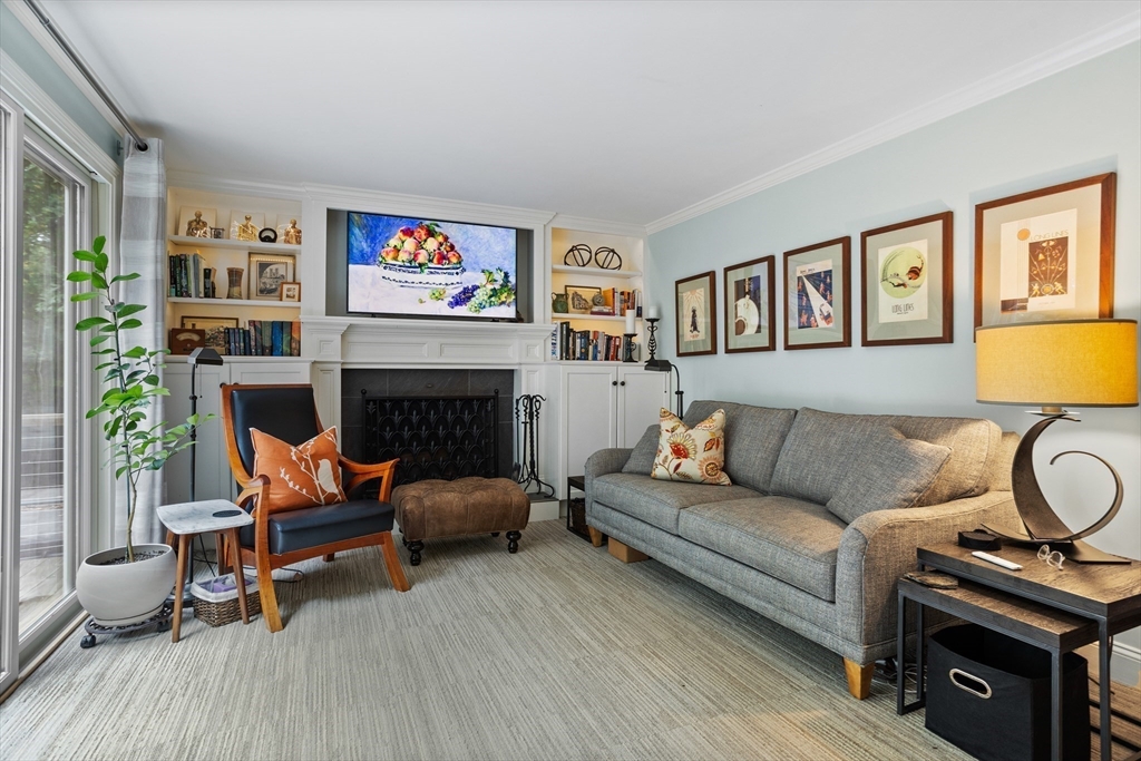 40 Richardson Road Boxborough, MA 01719 - Photo 16 of 39 a living room with furniture a flat screen tv and a fireplace