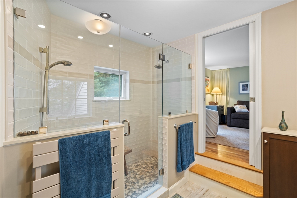 40 Richardson Road Boxborough, MA 01719 - Photo 28 of 39 a bathroom with a tub a sink a mirror and a shower