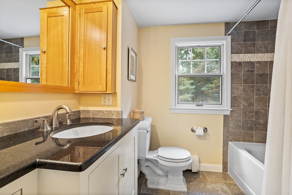 40 Richardson Road Boxborough, MA 01719 - Photo 33 of 39 a bathroom with a granite countertop sink toilet and shower