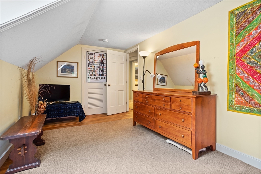 40 Richardson Road Boxborough, MA 01719 - Photo 36 of 39 a living room with furniture and a baby crib