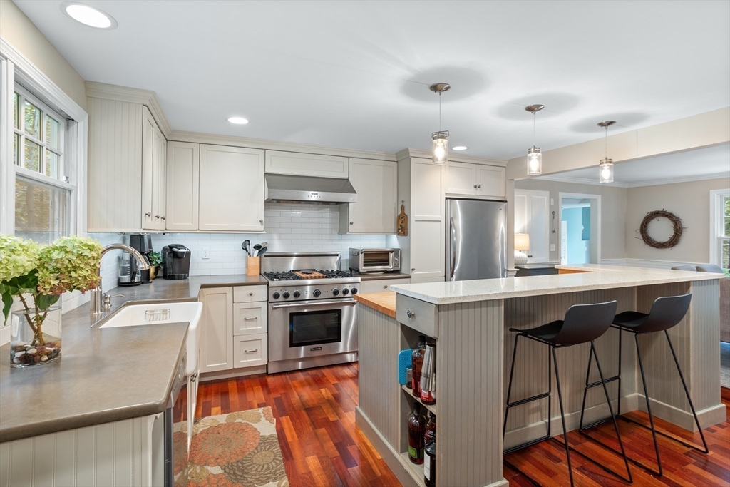 40 Richardson Road Boxborough, MA 01719 - Photo 4 of 39 a kitchen with a table chairs stove and cabinets