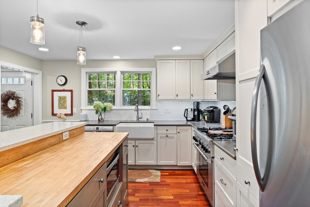 40 Richardson Road Boxborough, MA 01719 - Photo 6 of 39 a kitchen with a sink a counter top space stainless steel appliances a window and a counter top space