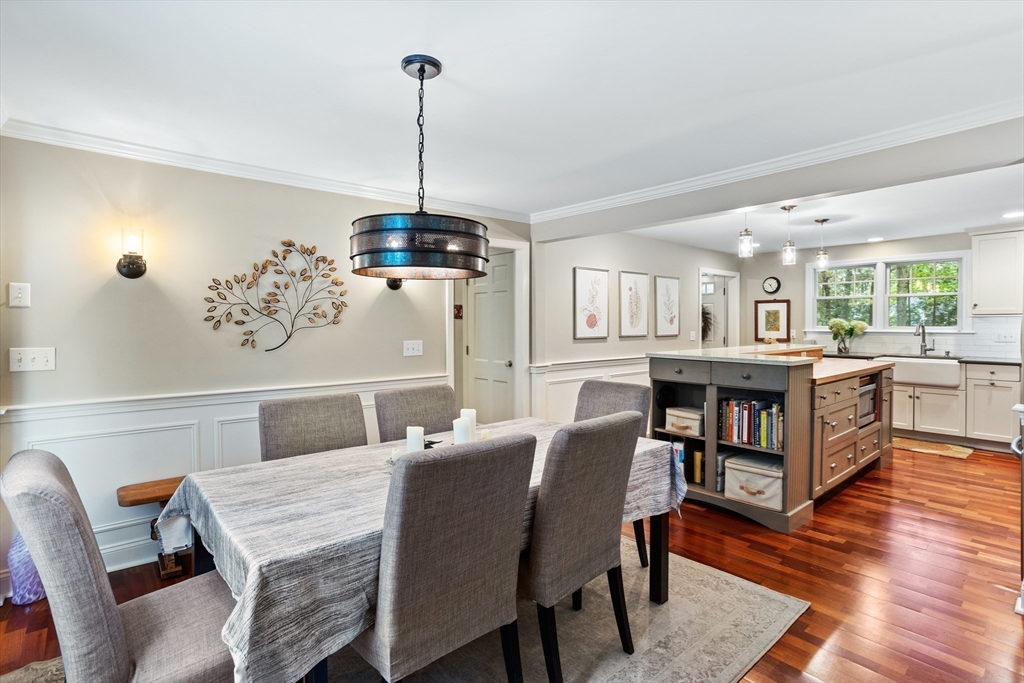 40 Richardson Road Boxborough, MA 01719 - Photo 9 of 39 a view of a dining room and livingroom with furniture wooden floor a chandelier