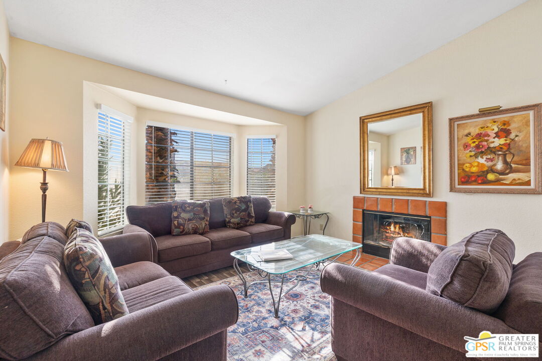 45688 Sutter Creek Road Indio, CA 92201 - Photo 9 of 51 a living room with furniture and a large window