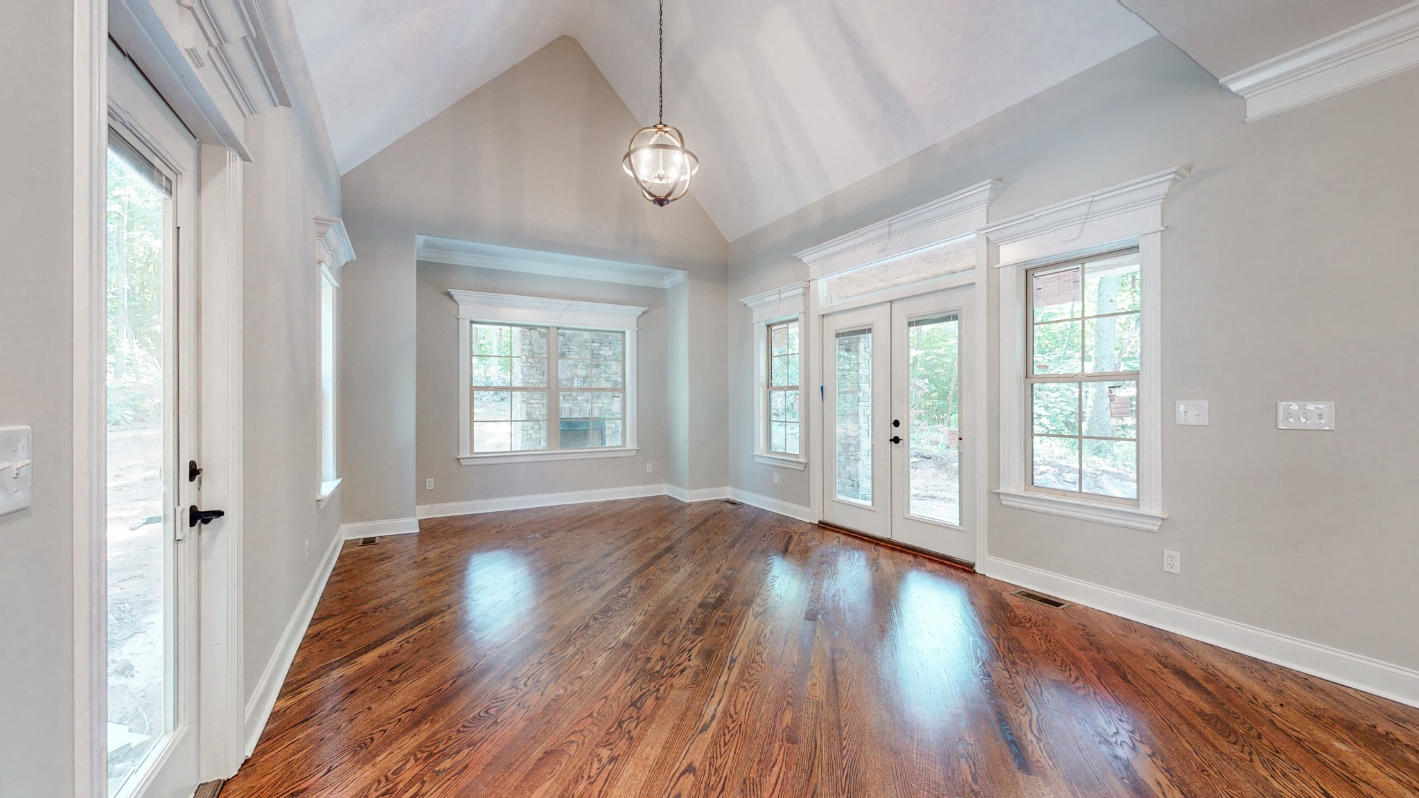 3191 B Greens Mill Road Spring Hill, TN 37174 - Photo 12 of 50 a view of an empty room with wooden floor and a window