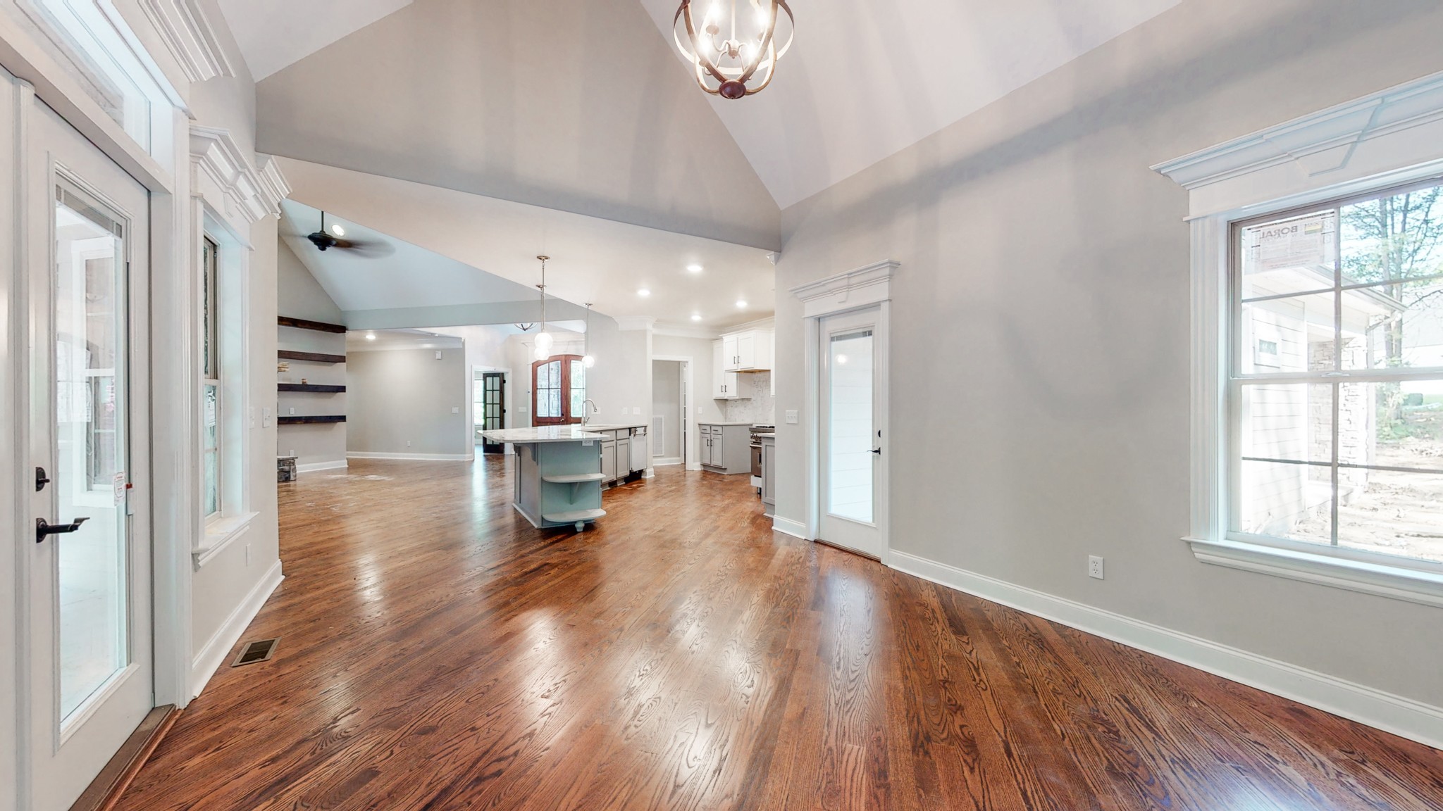 3191 B Greens Mill Road Spring Hill, TN 37174 - Photo 15 of 50 a view of a living room and kitchen with a large window