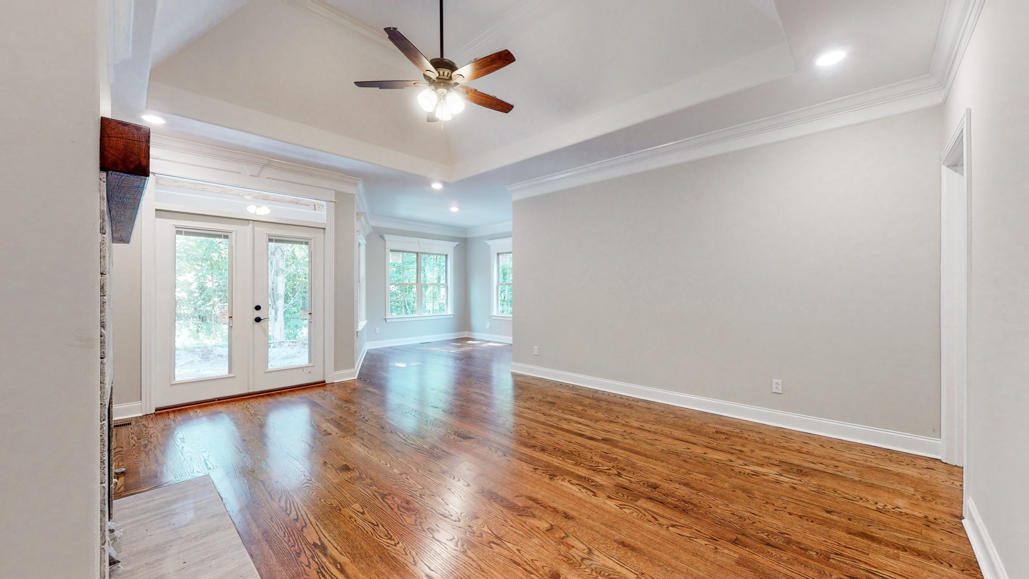 3191 B Greens Mill Road Spring Hill, TN 37174 - Photo 19 of 50 an empty room with wooden floor and windows