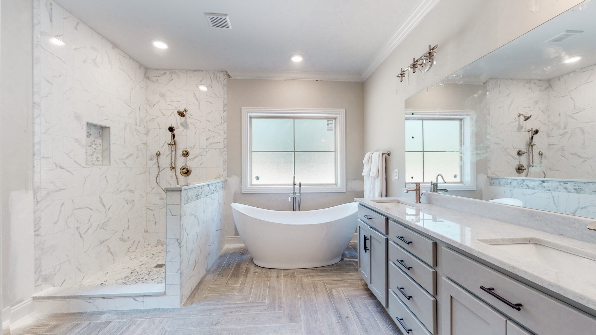 3191 B Greens Mill Road Spring Hill, TN 37174 - Photo 23 of 50 a spacious bathroom with a bathtub shower sink and mirror