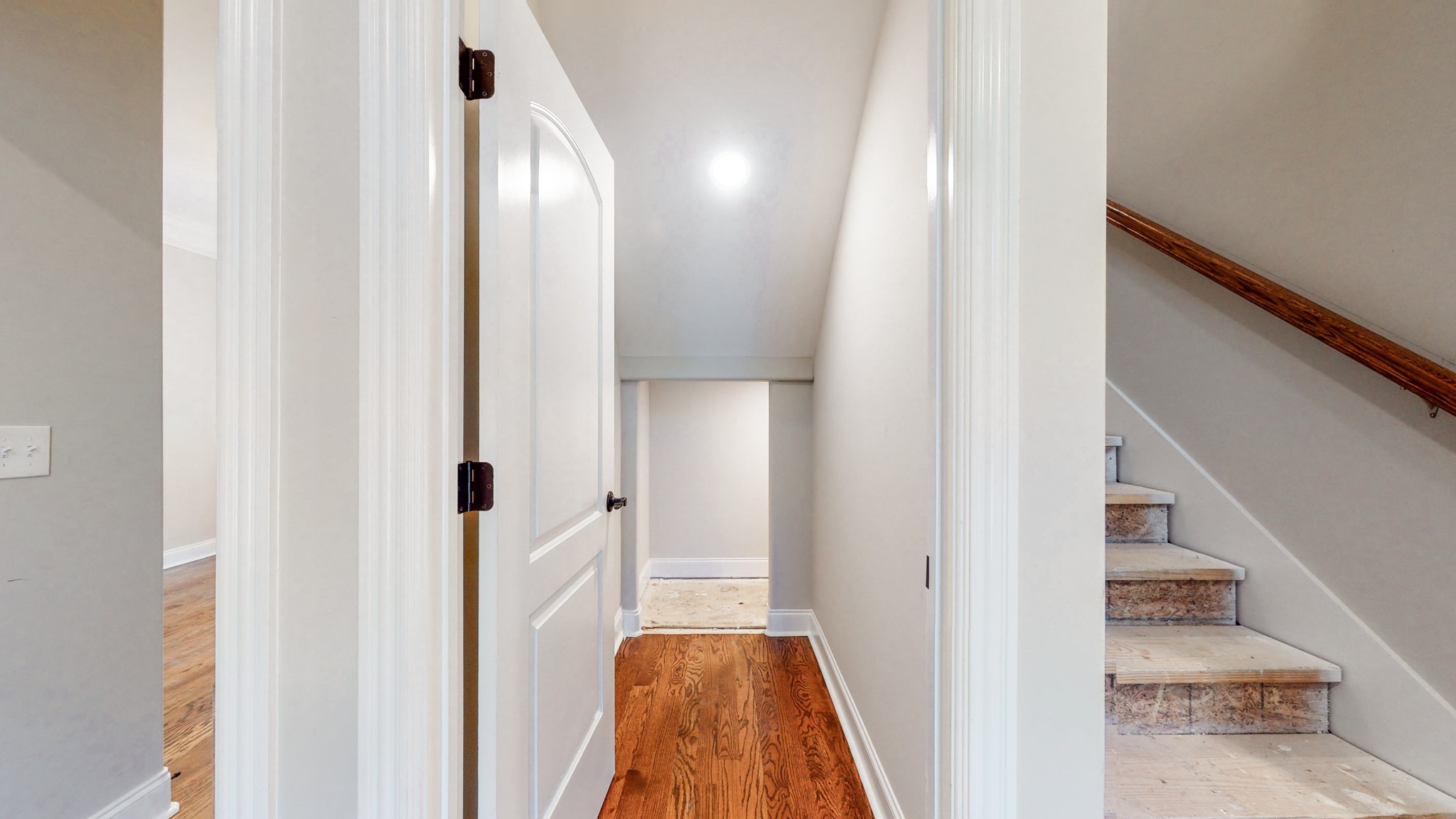 3191 B Greens Mill Road Spring Hill, TN 37174 - Photo 37 of 50 a view of a hallway with wooden floor and staircase