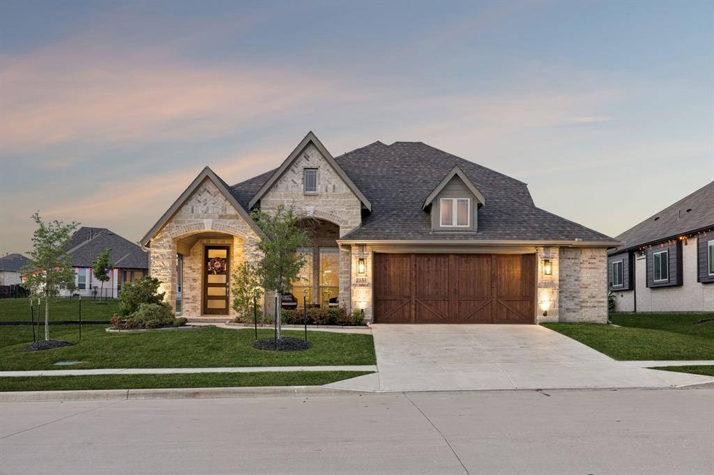 2137 Charming Frg Road Forney, TX 75126 - Photo 1 of 35 a front view of a house with a yard