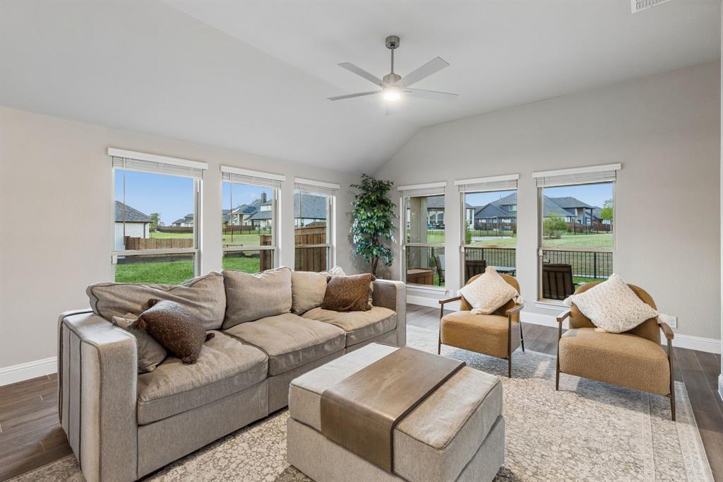 2137 Charming Frg Road Forney, TX 75126 - Photo 13 of 35 a living room with furniture and a large window