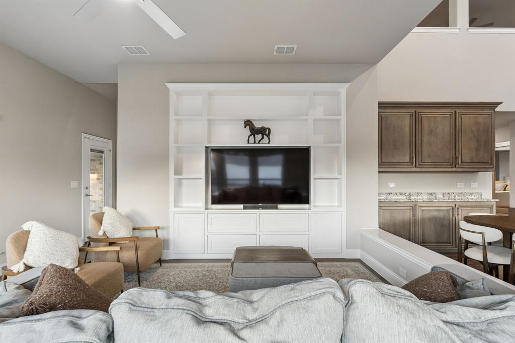 2137 Charming Frg Road Forney, TX 75126 - Photo 15 of 35 a bedroom with furniture and a flat screen tv
