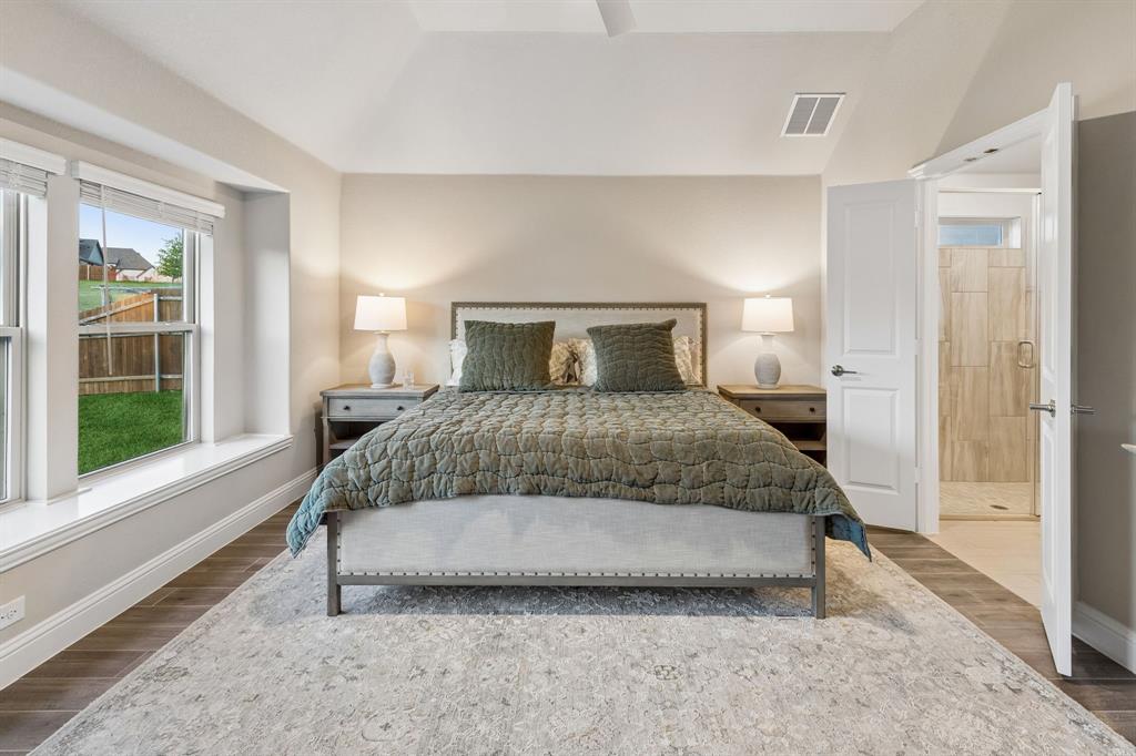 2137 Charming Frg Road Forney, TX 75126 - Photo 17 of 35 a bedroom with a bed and wooden floor