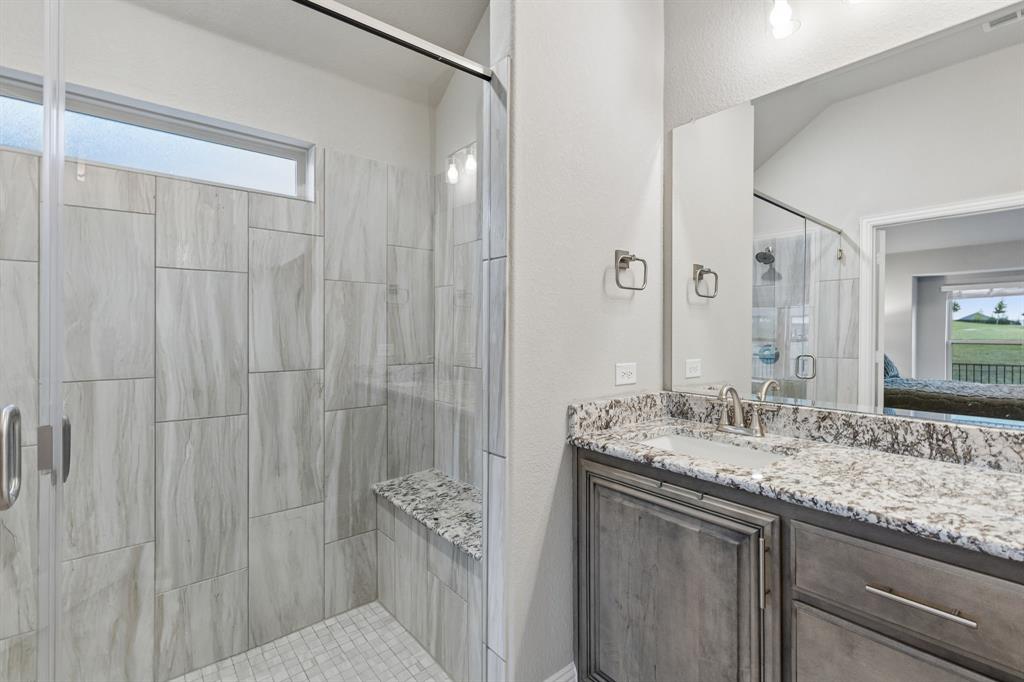 2137 Charming Frg Road Forney, TX 75126 - Photo 20 of 35 a bathroom with a granite countertop sink and a mirror