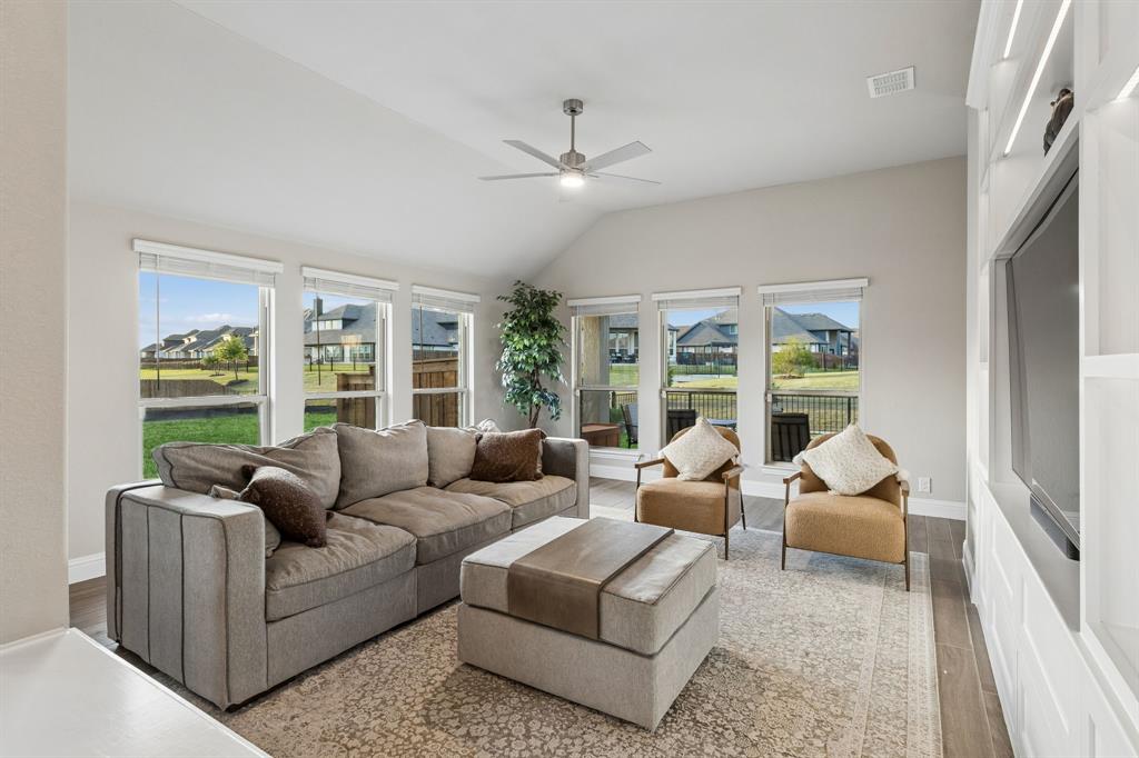 2137 Charming Frg Road Forney, TX 75126 - Photo 2 of 35 a living room with furniture and a large window