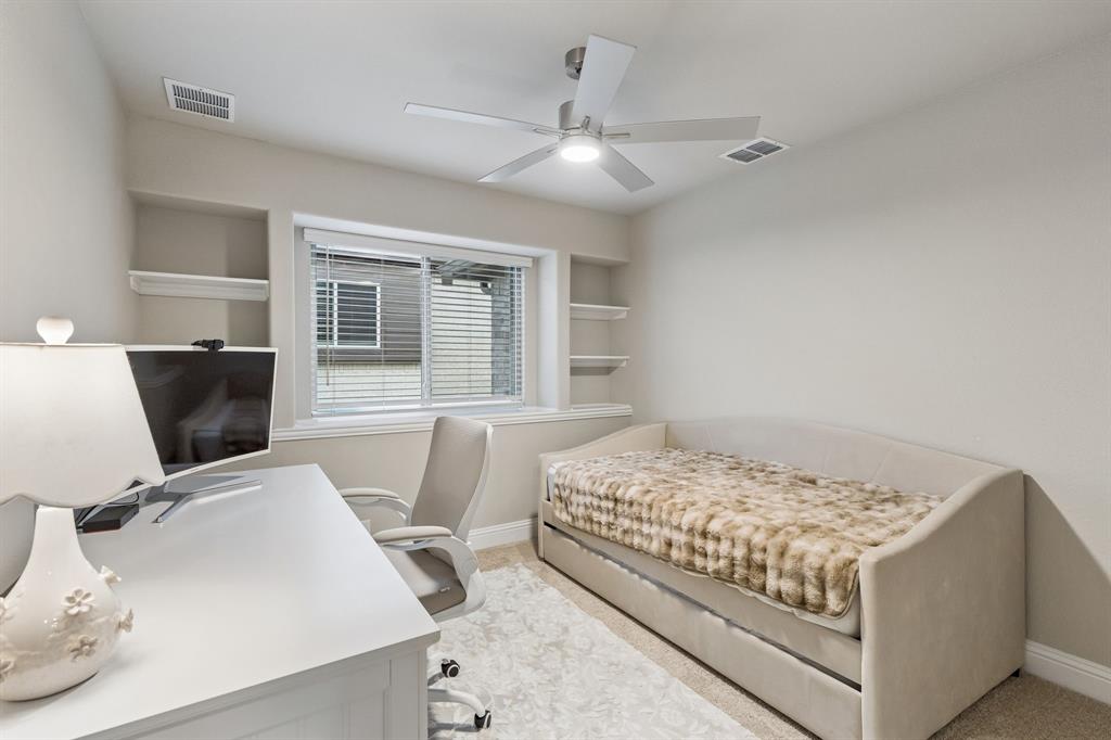 2137 Charming Frg Road Forney, TX 75126 - Photo 22 of 35 a bedroom with a bed and a flat screen tv