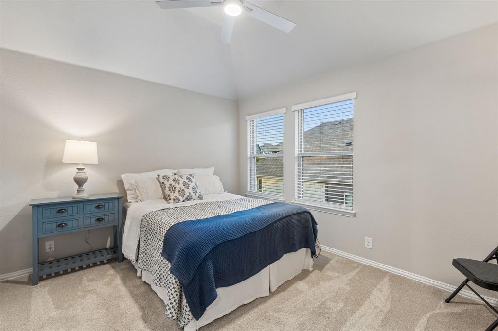 2137 Charming Frg Road Forney, TX 75126 - Photo 24 of 35 a bedroom with a bed and a window